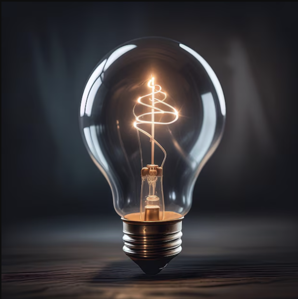AA.plain lightbulb on desk | The Heel Centre